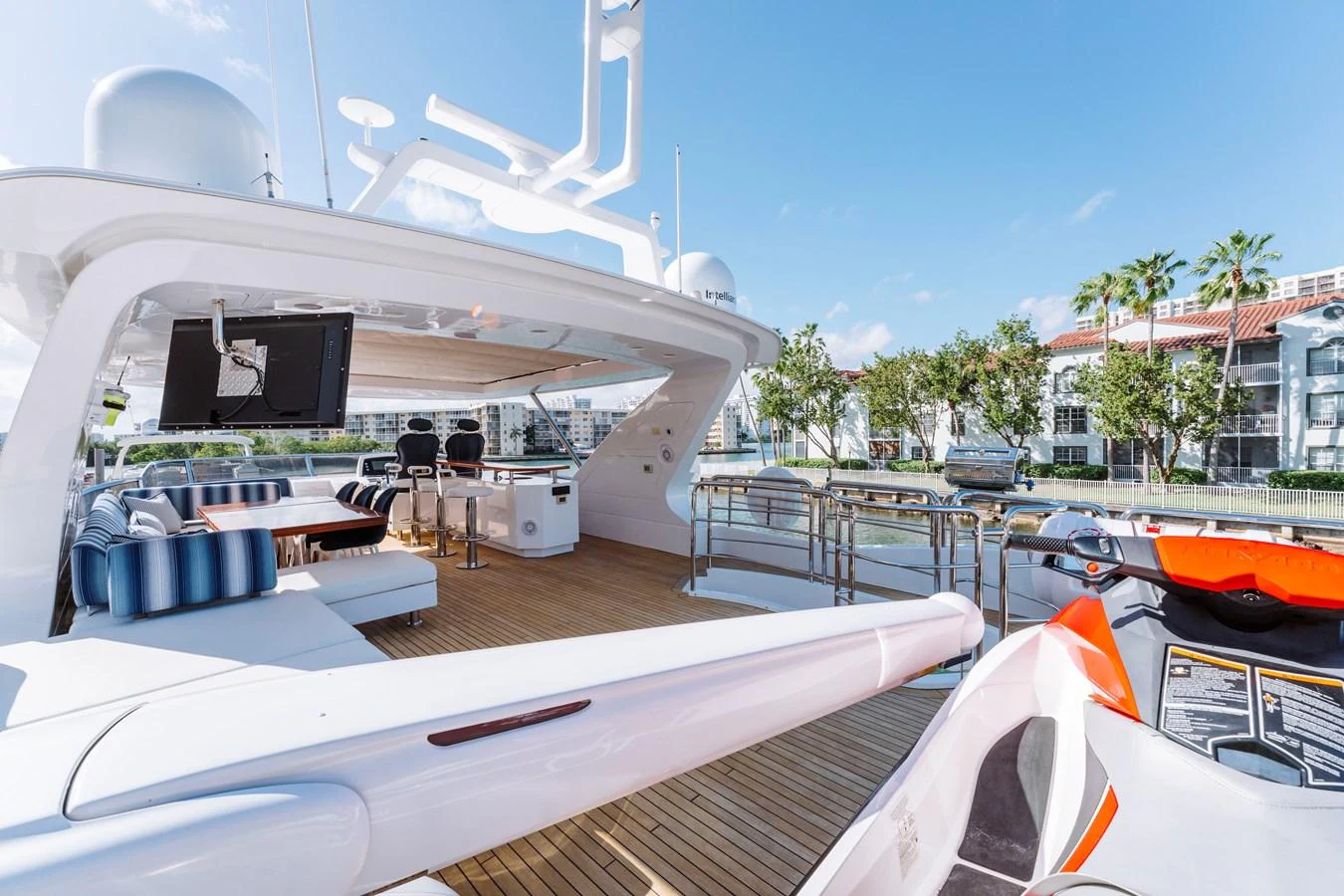 a white boat with a black screen aboard RESET Yacht for Sale