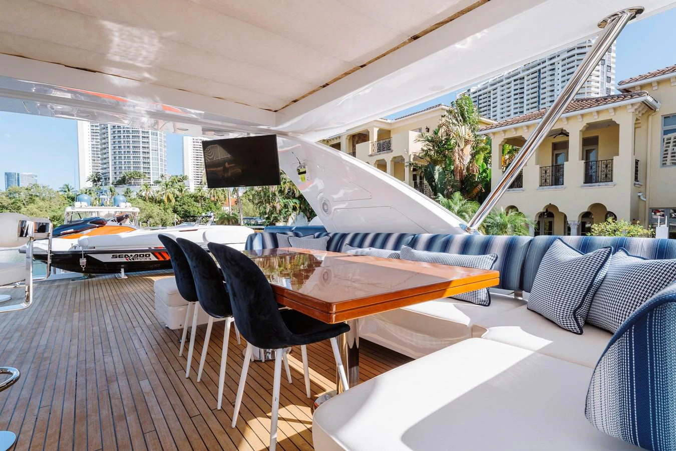 a deck with a table and chairs aboard RESET Yacht for Sale