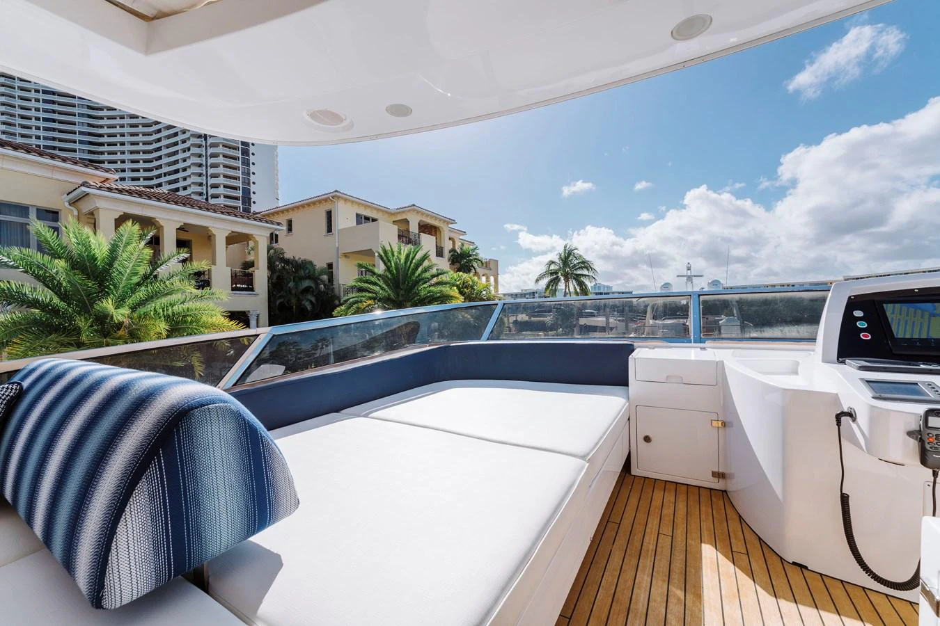 a large balcony overlooking a pool aboard RESET Yacht for Sale