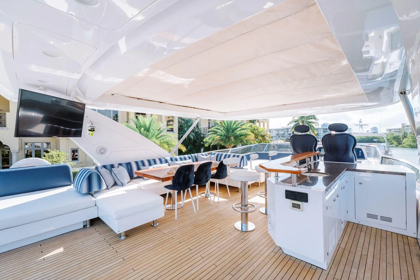 a room with a couch and a television aboard RESET Yacht for Sale