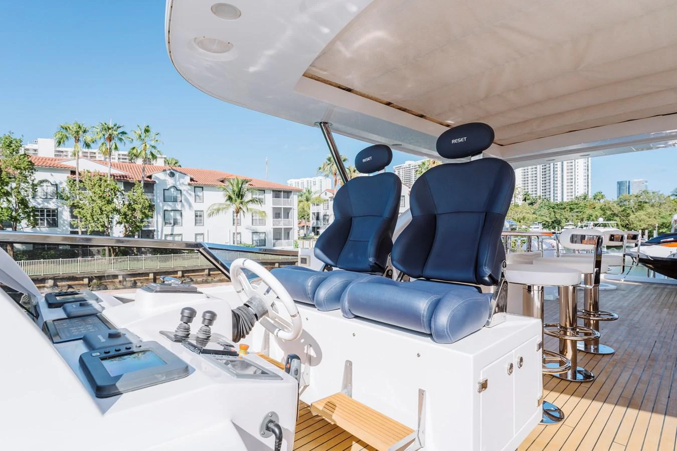a pool table and chairs on a deck aboard RESET Yacht for Sale