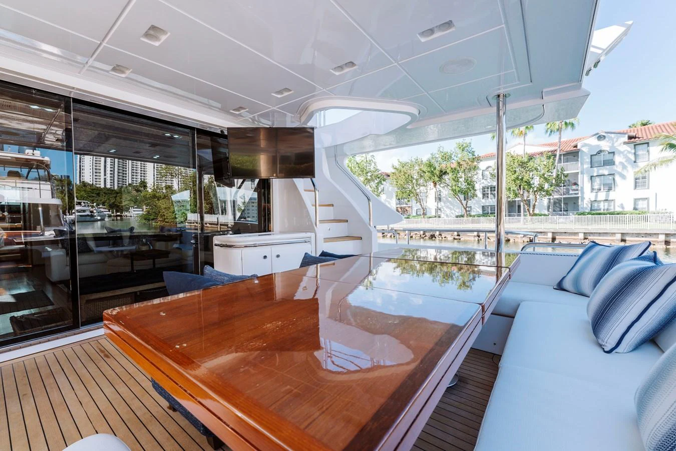 a room with a table and a couch aboard RESET Yacht for Sale