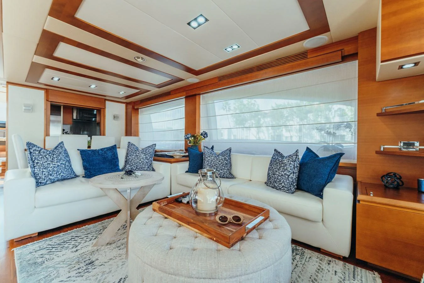 a living room with a couch and a coffee table aboard RESET Yacht for Sale
