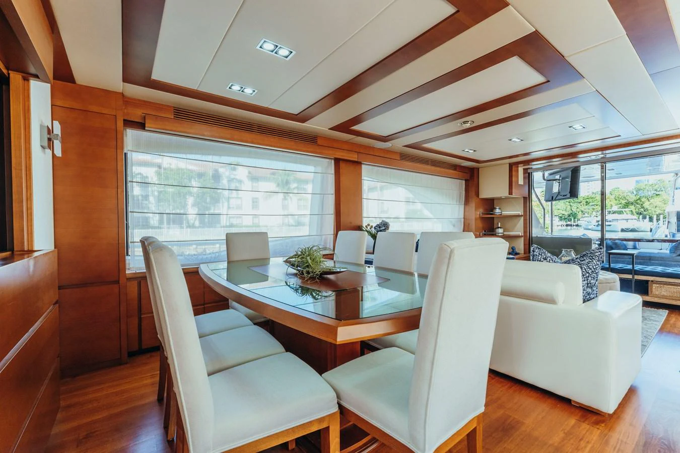 a dining room with a table and chairs aboard RESET Yacht for Sale