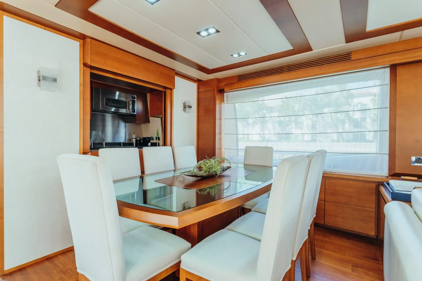 a dining room with a table and chairs aboard RESET Yacht for Sale