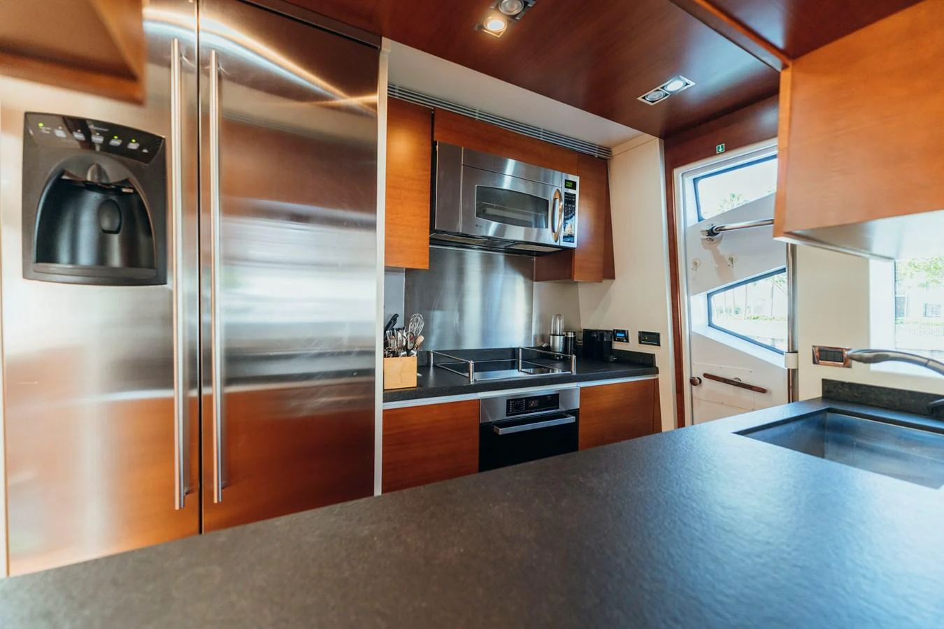 a kitchen with stainless steel appliances aboard RESET Yacht for Sale