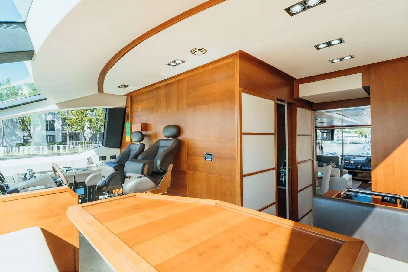 a room with a table and chairs aboard RESET Yacht for Sale