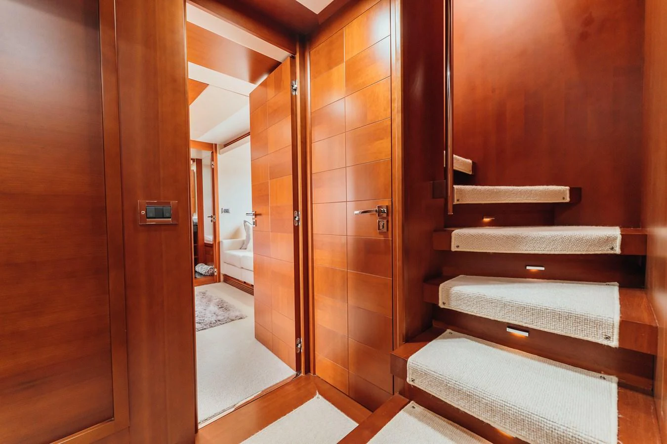 a room with a bed and a door aboard RESET Yacht for Sale