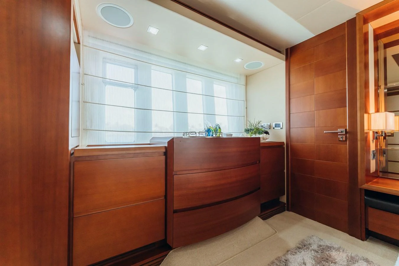 a room with a wood cabinet and cabinets aboard RESET Yacht for Sale