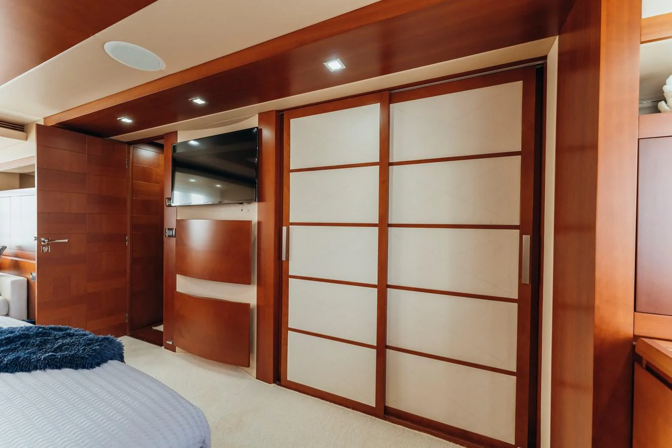 a room with a bed and a closet aboard RESET Yacht for Sale