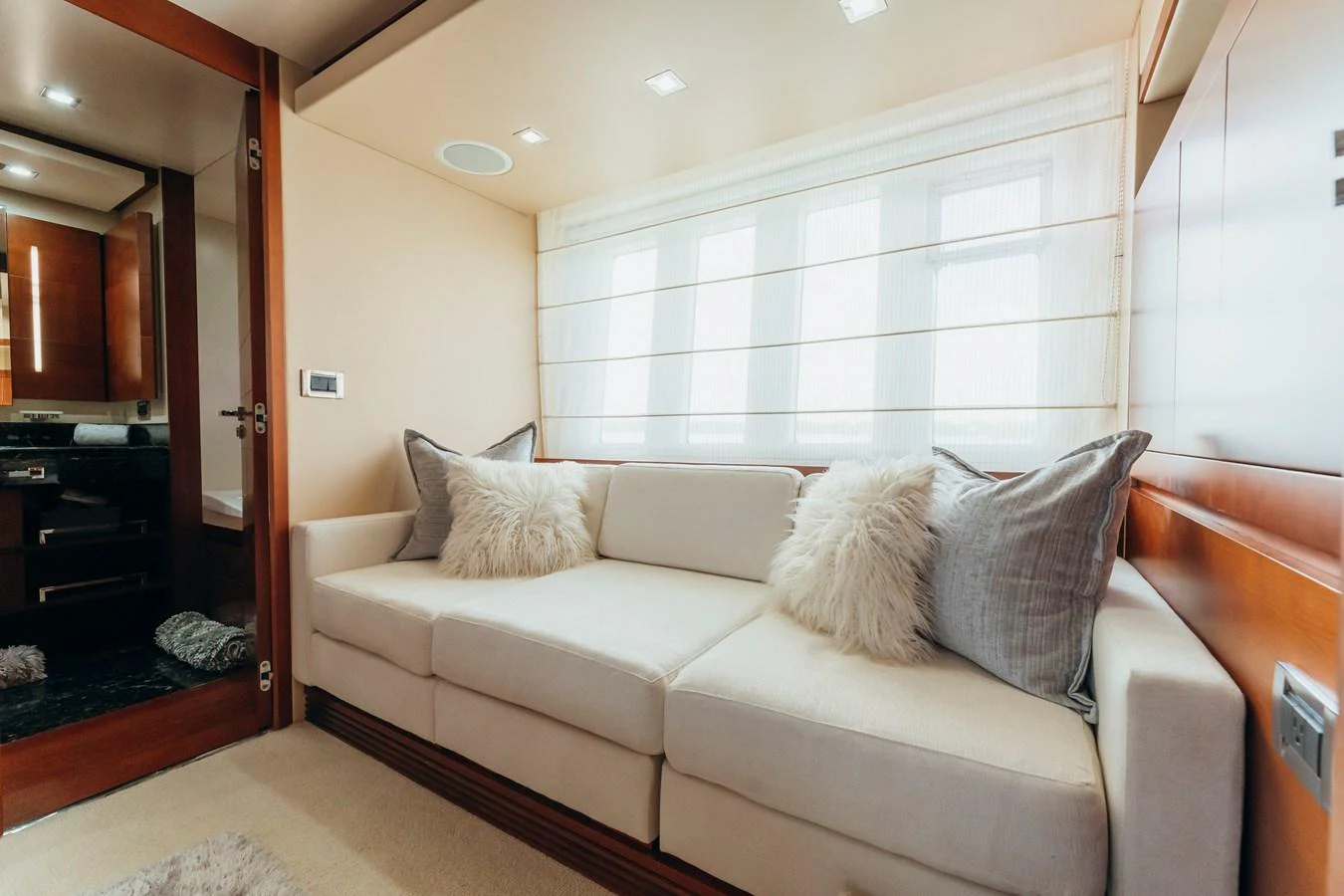 a couch in a living room aboard RESET Yacht for Sale