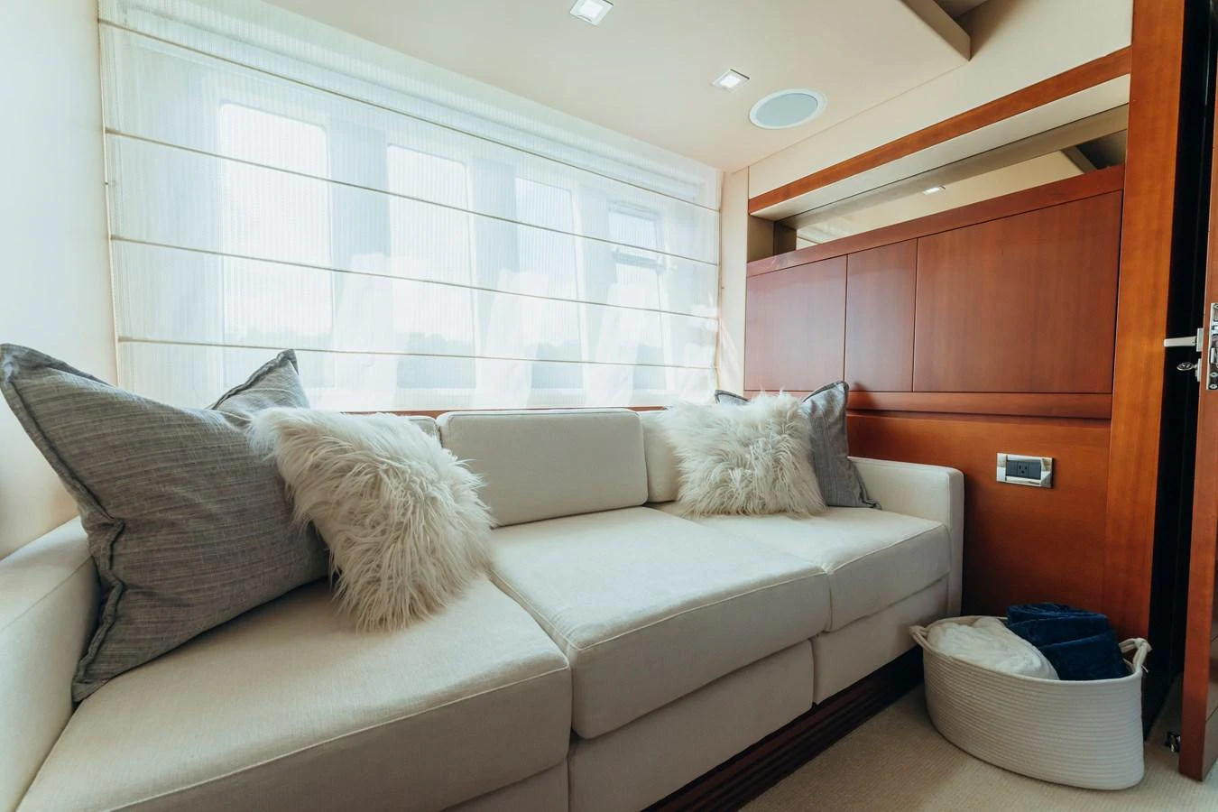 a couch in a room aboard RESET Yacht for Sale