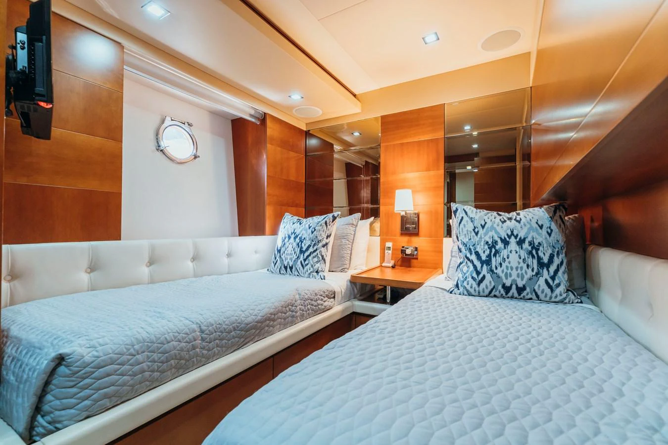 a room with two beds aboard RESET Yacht for Sale