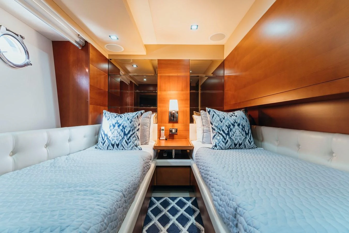 a room with two beds aboard RESET Yacht for Sale