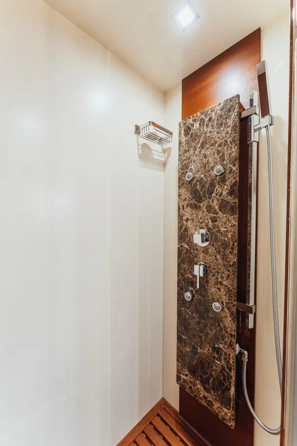a wall with a shower curtain aboard RESET Yacht for Sale