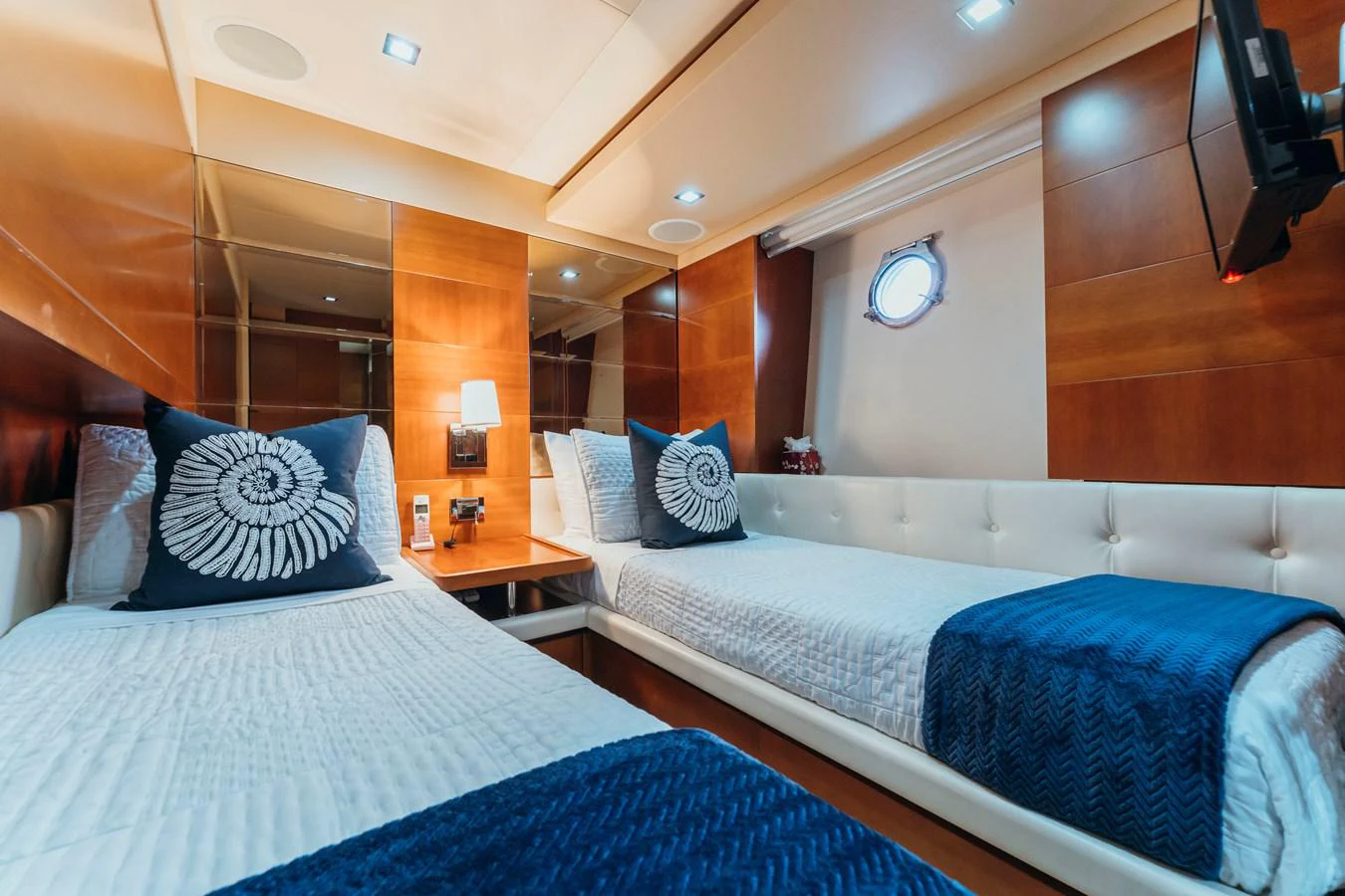a couple of beds in a room aboard RESET Yacht for Sale