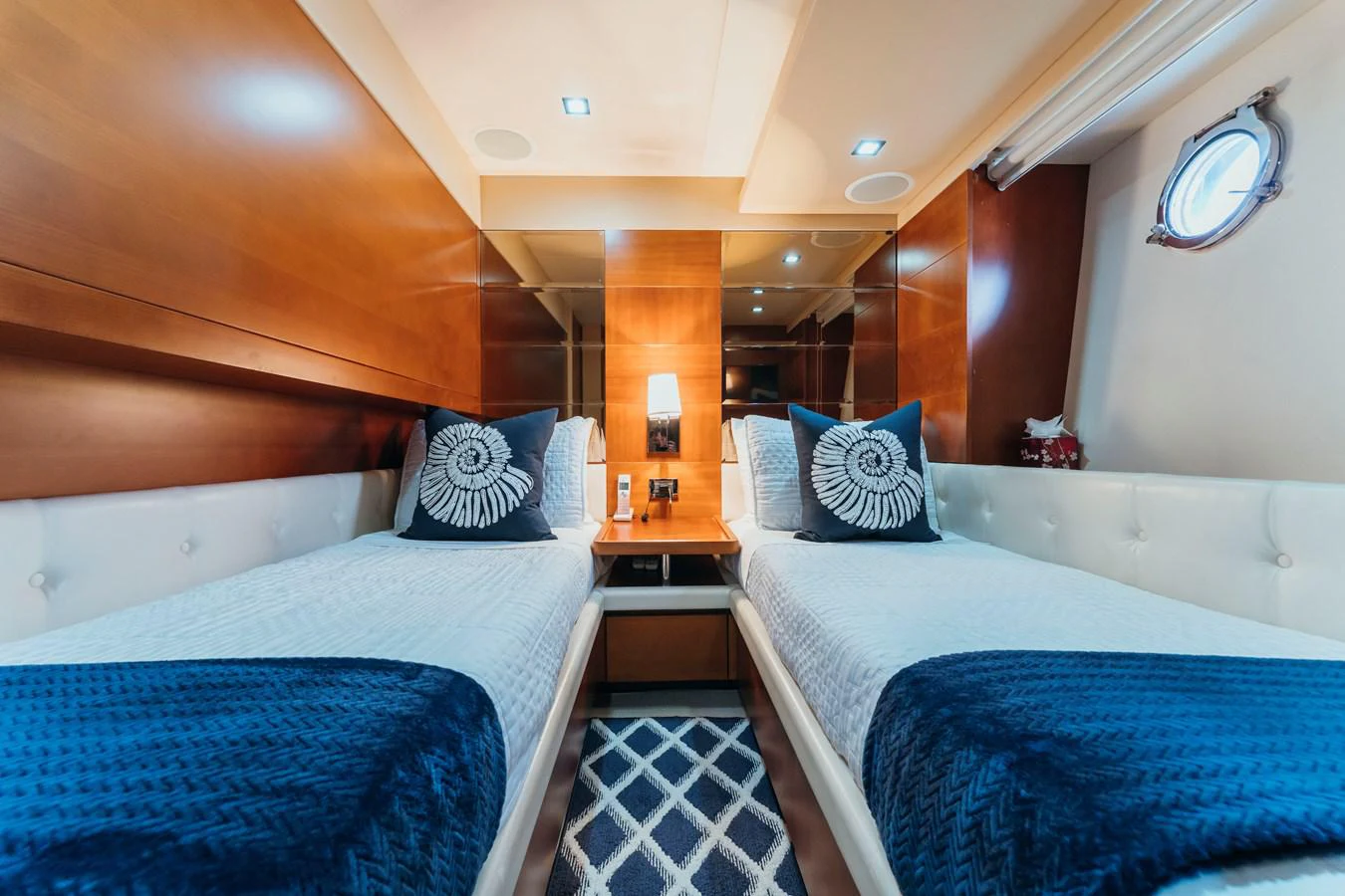 a couple of beds in a room aboard RESET Yacht for Sale