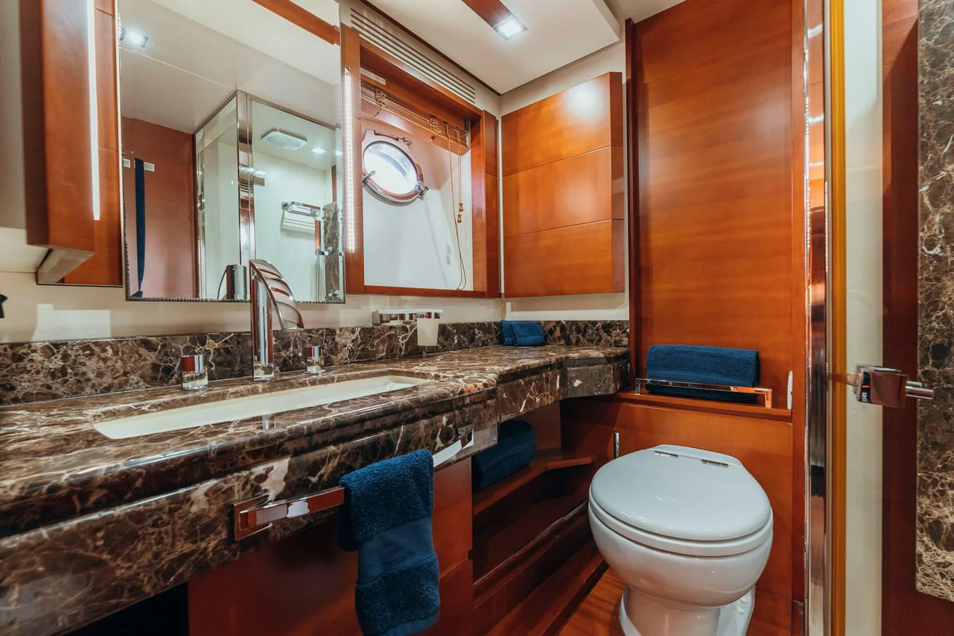 a bathroom with a toilet and a sink aboard RESET Yacht for Sale