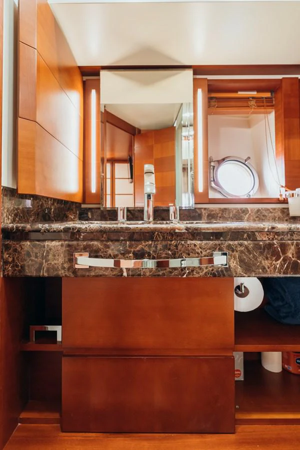 a bathroom with a marble counter top aboard RESET Yacht for Sale