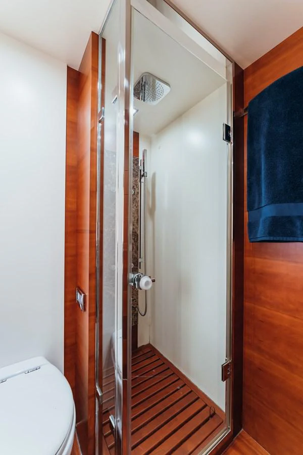 a bathroom with a shower unit aboard RESET Yacht for Sale
