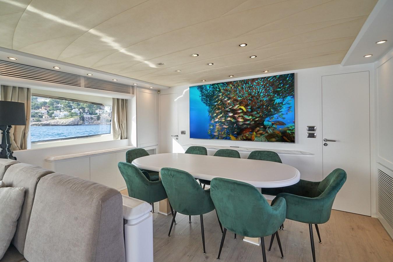 a room with a table and chairs aboard KIAWAH II Yacht for Charter