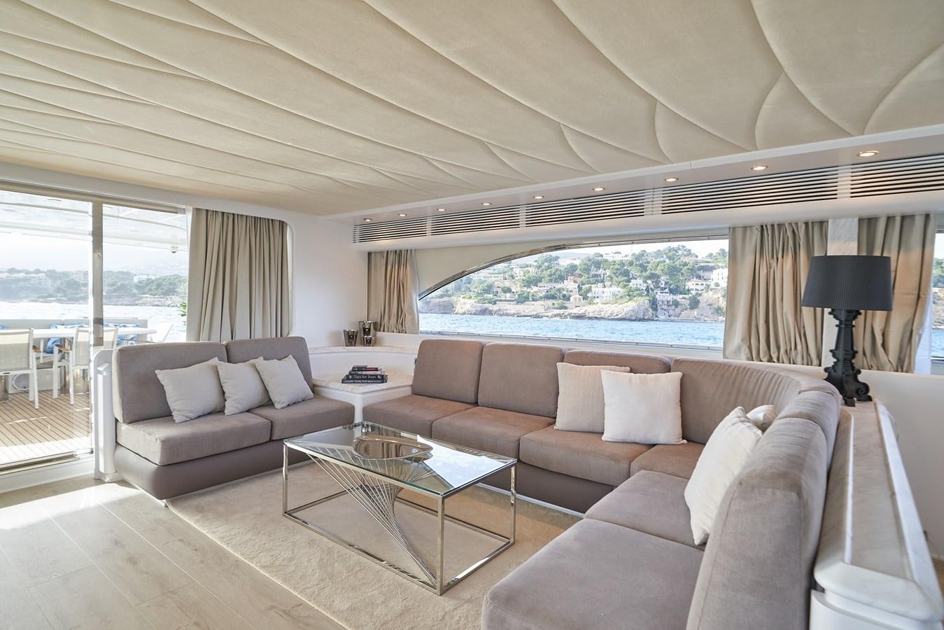 a living room with a large window aboard KIAWAH II Yacht for Charter