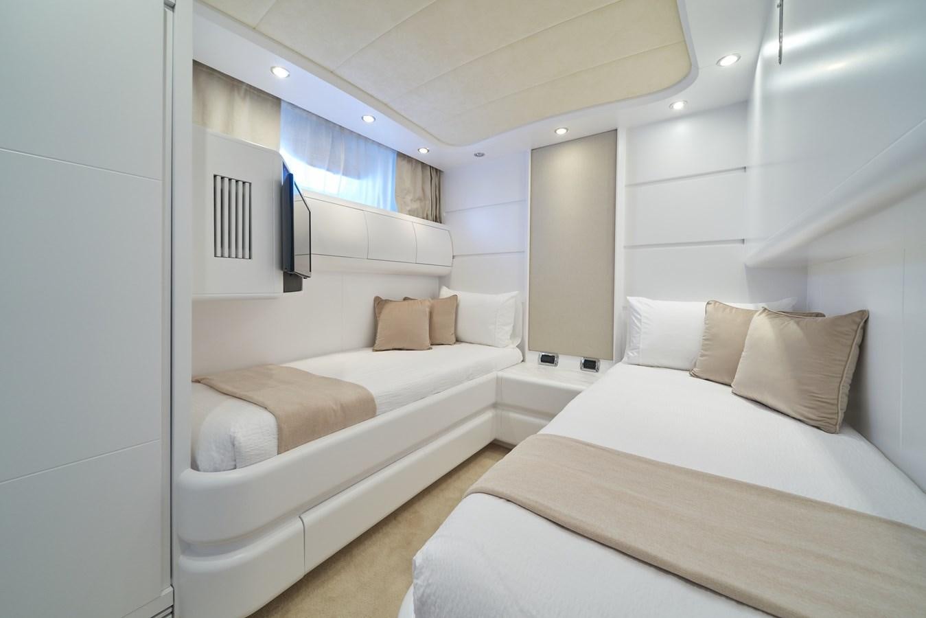 a room with a couple of beds aboard KIAWAH II Yacht for Charter