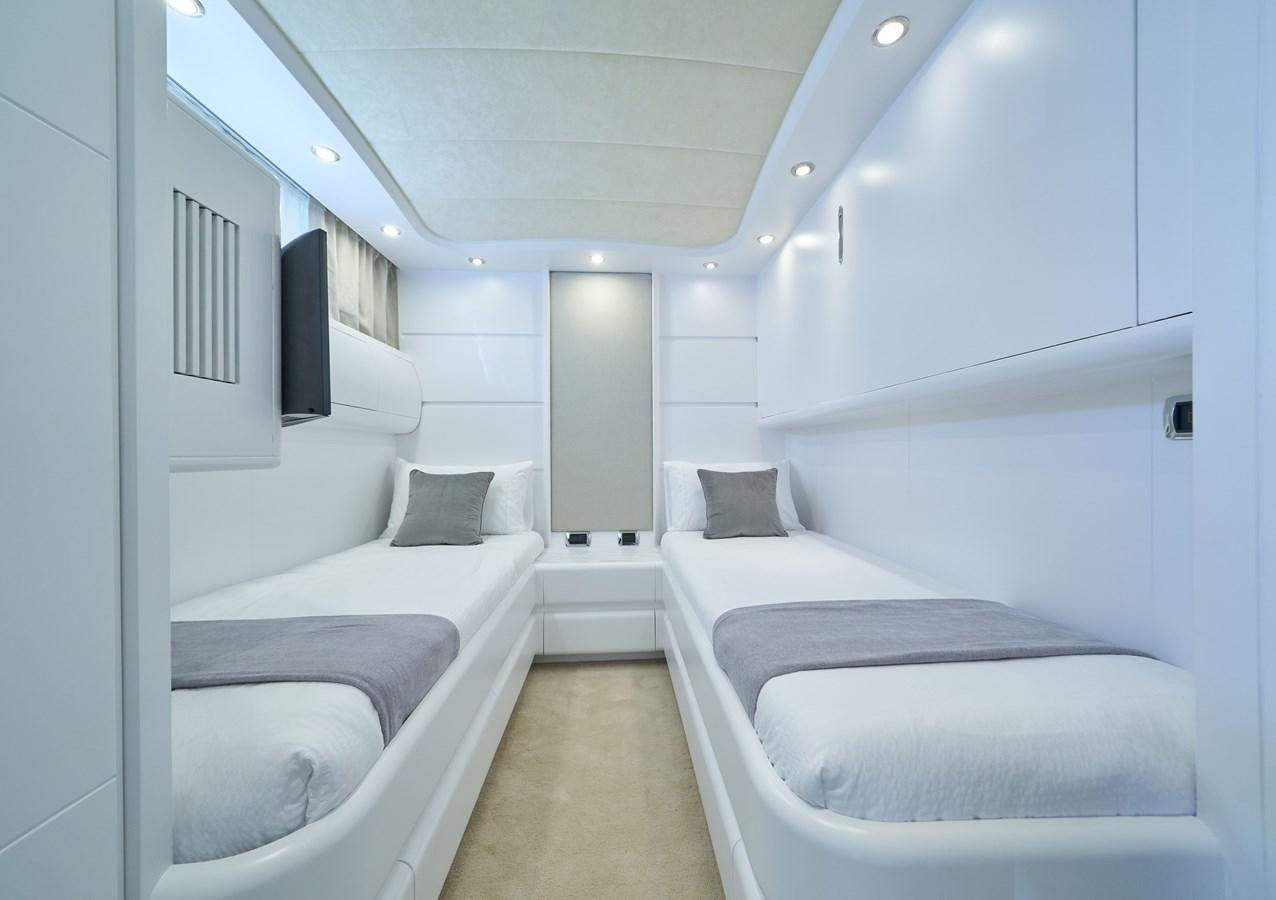 a room with several beds aboard KIAWAH II Yacht for Charter