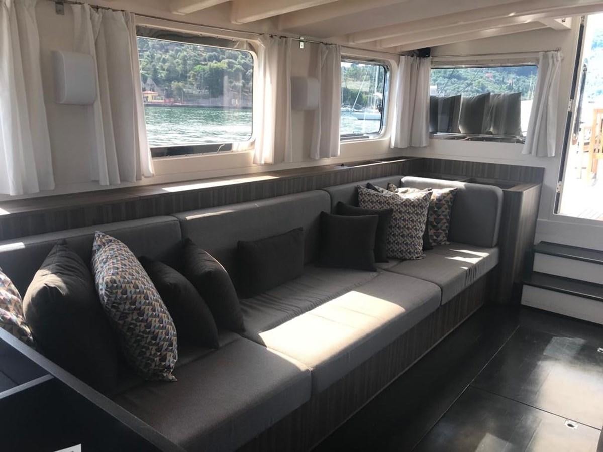 a couch in a living room aboard BLACKWOOD I Yacht for Sale