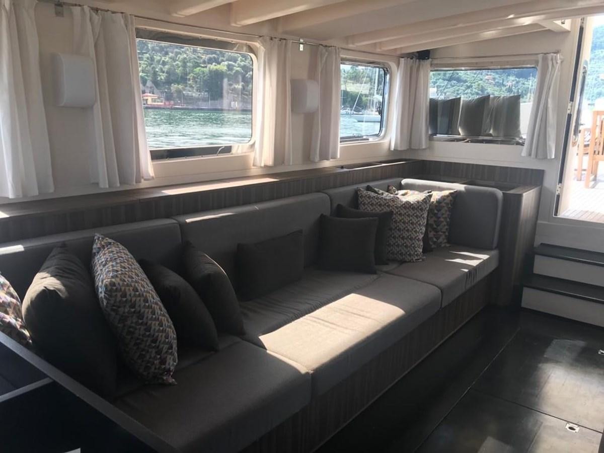a couch in a living room aboard BLACKWOOD I Yacht for Sale