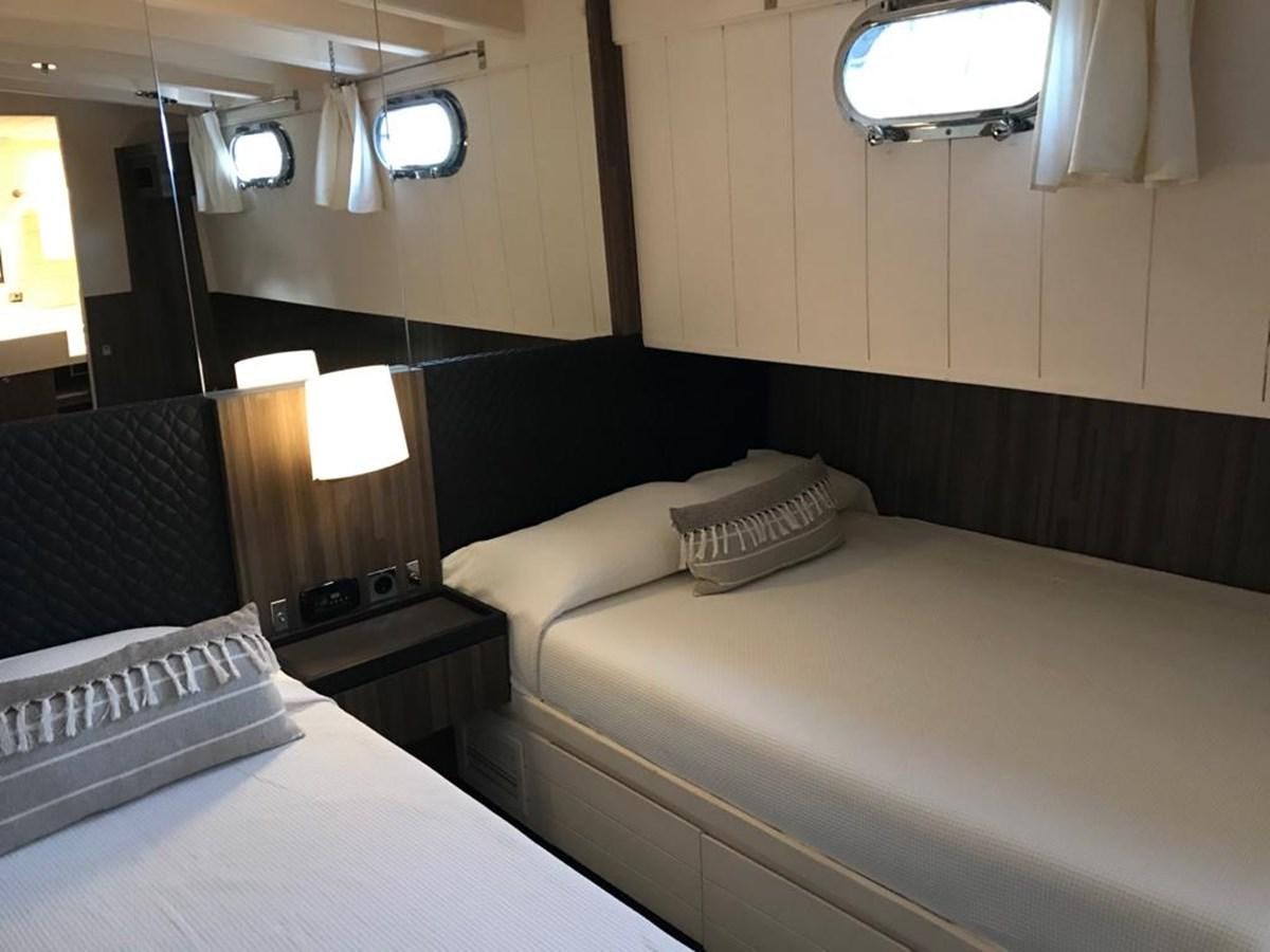 a room with two beds aboard BLACKWOOD I Yacht for Sale
