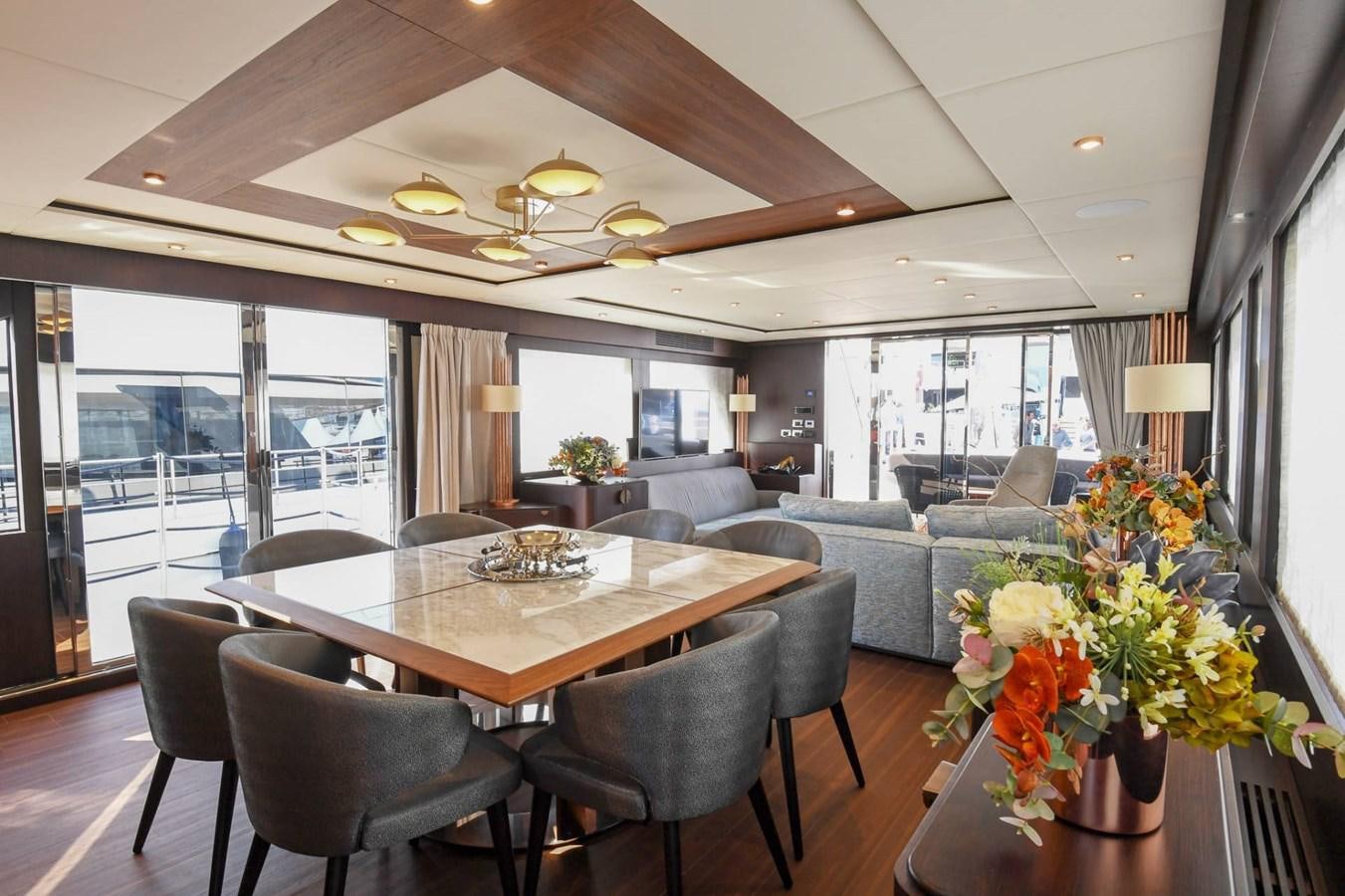 a large dining room with a large table and chairs aboard CECILOU Yacht for Sale