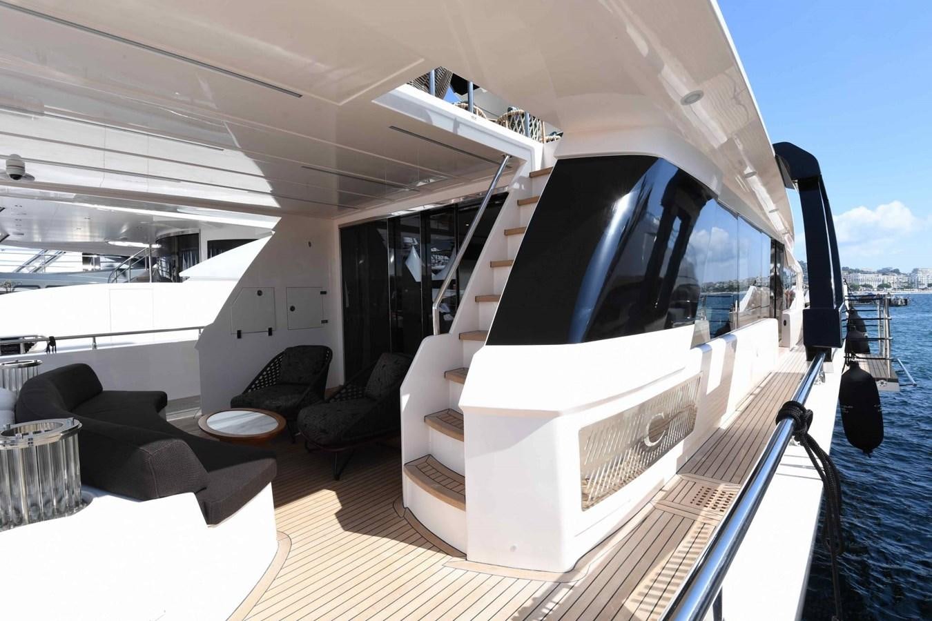 a boat with a large deck aboard CECILOU Yacht for Sale
