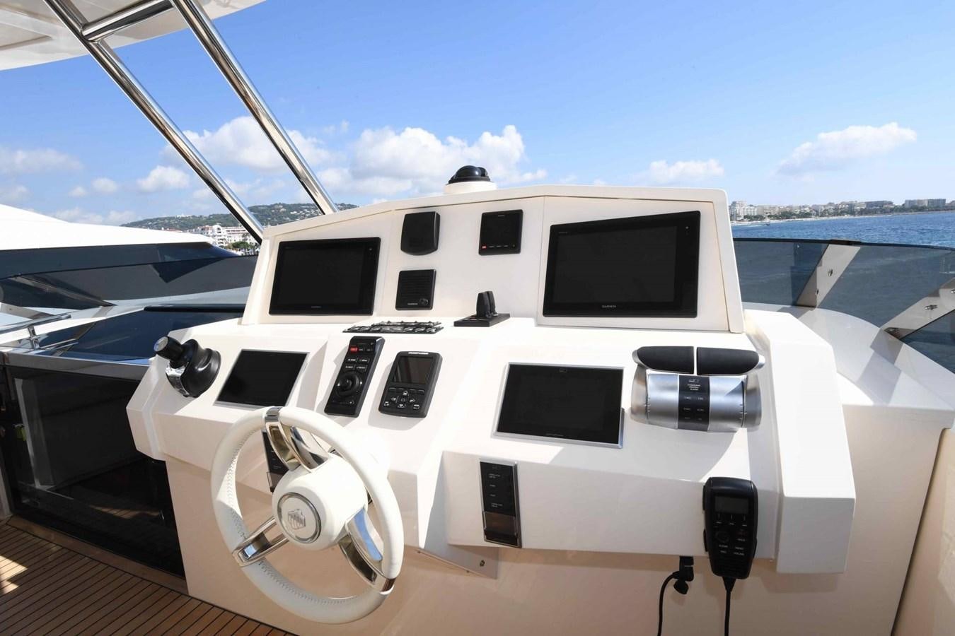 a white yacht on a deck aboard CECILOU Yacht for Sale