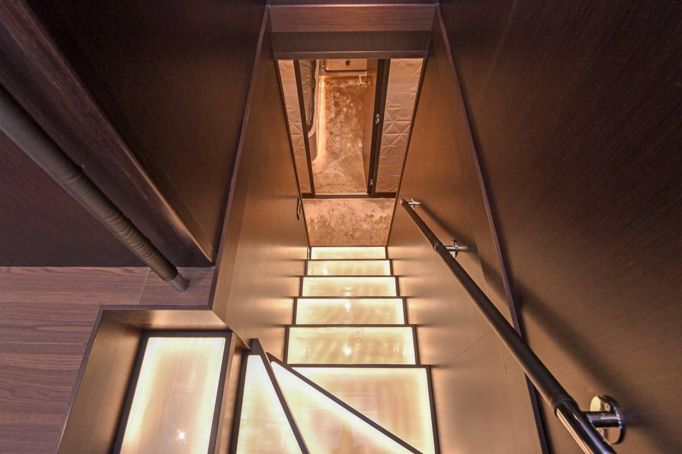 a staircase with glass doors aboard CECILOU Yacht for Sale