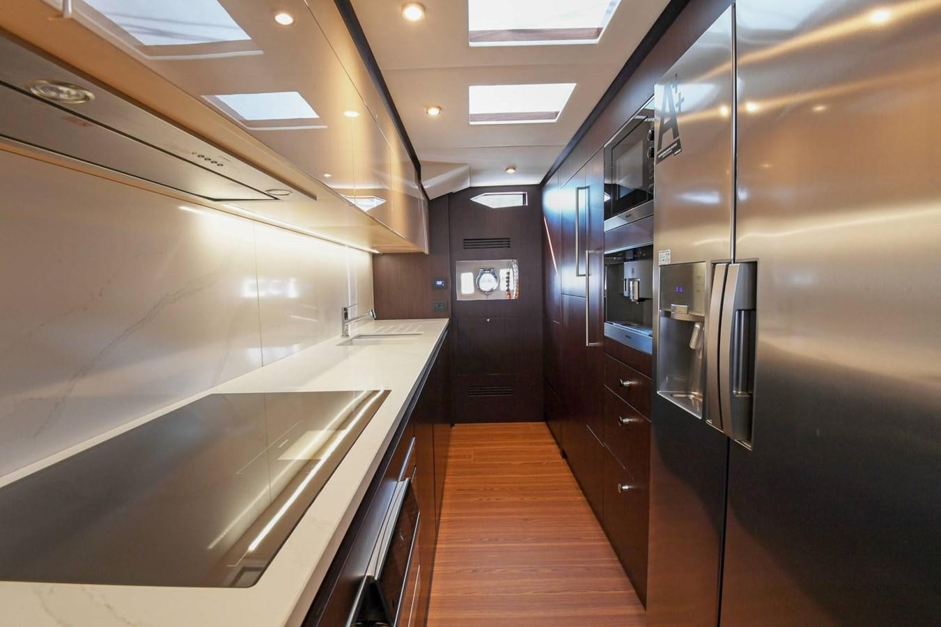 a kitchen with stainless steel appliances aboard CECILOU Yacht for Sale