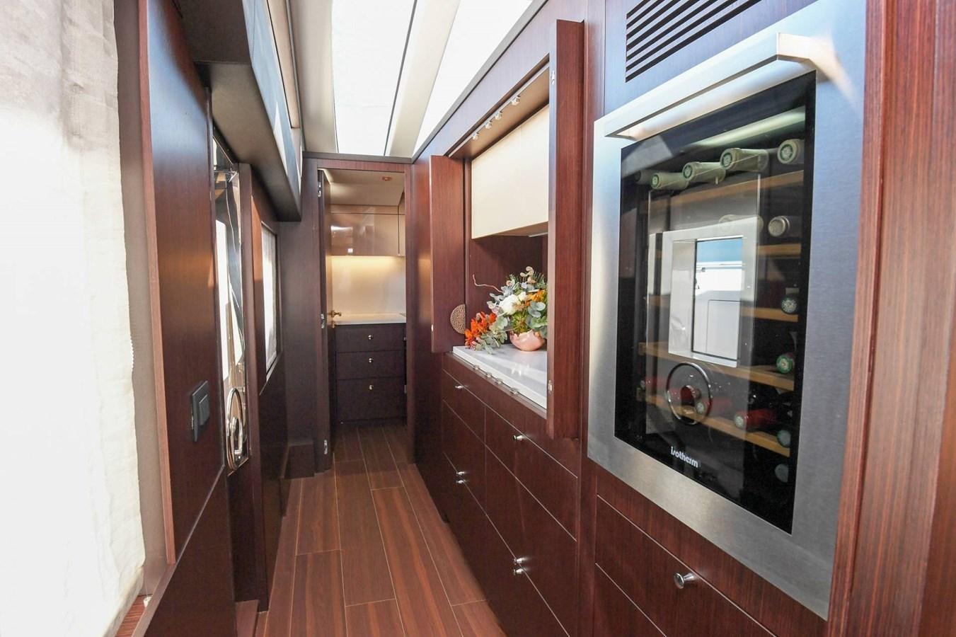 a hallway with a glass door aboard CECILOU Yacht for Sale