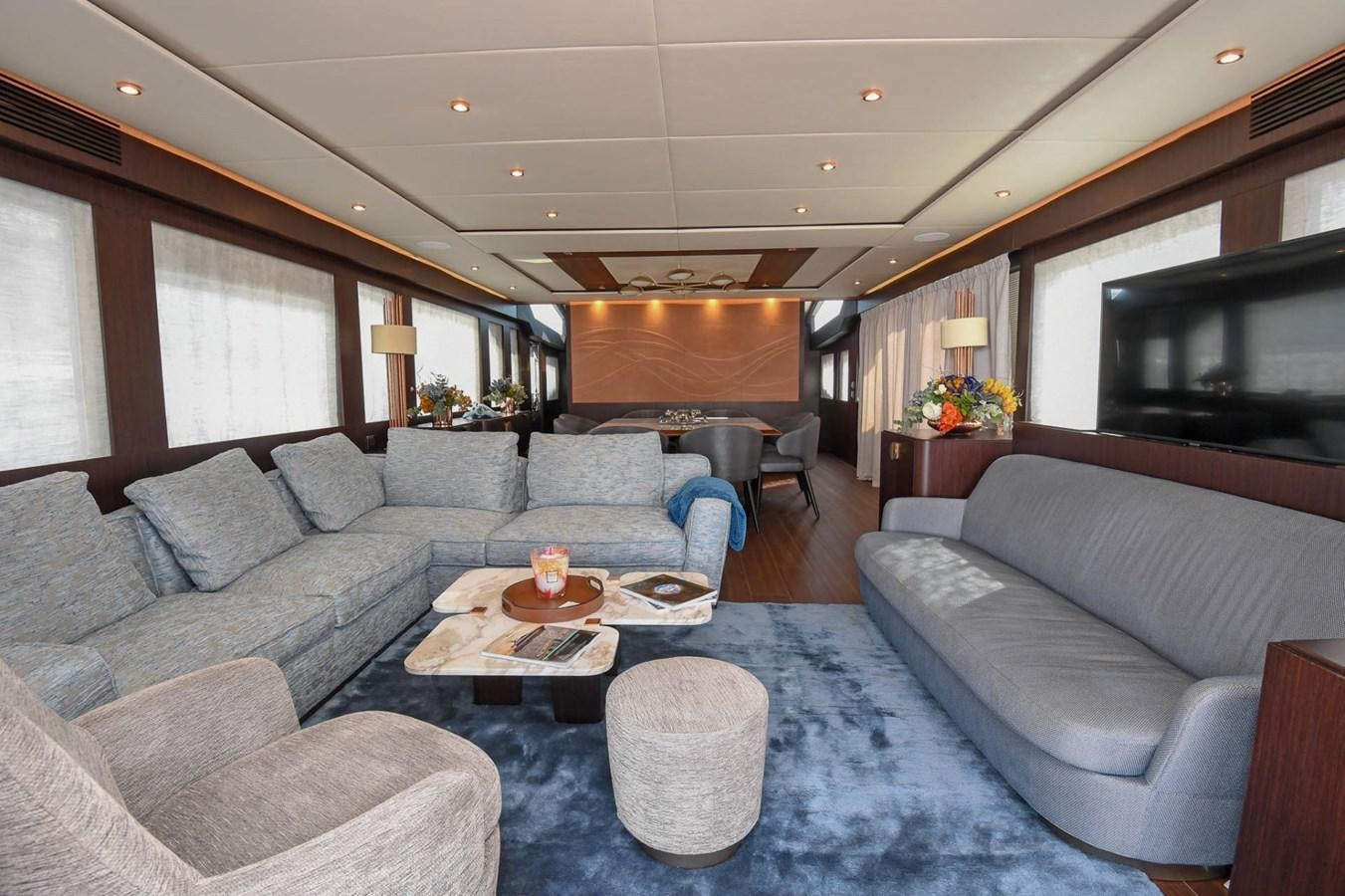 a living room with a couch and a television aboard CECILOU Yacht for Sale