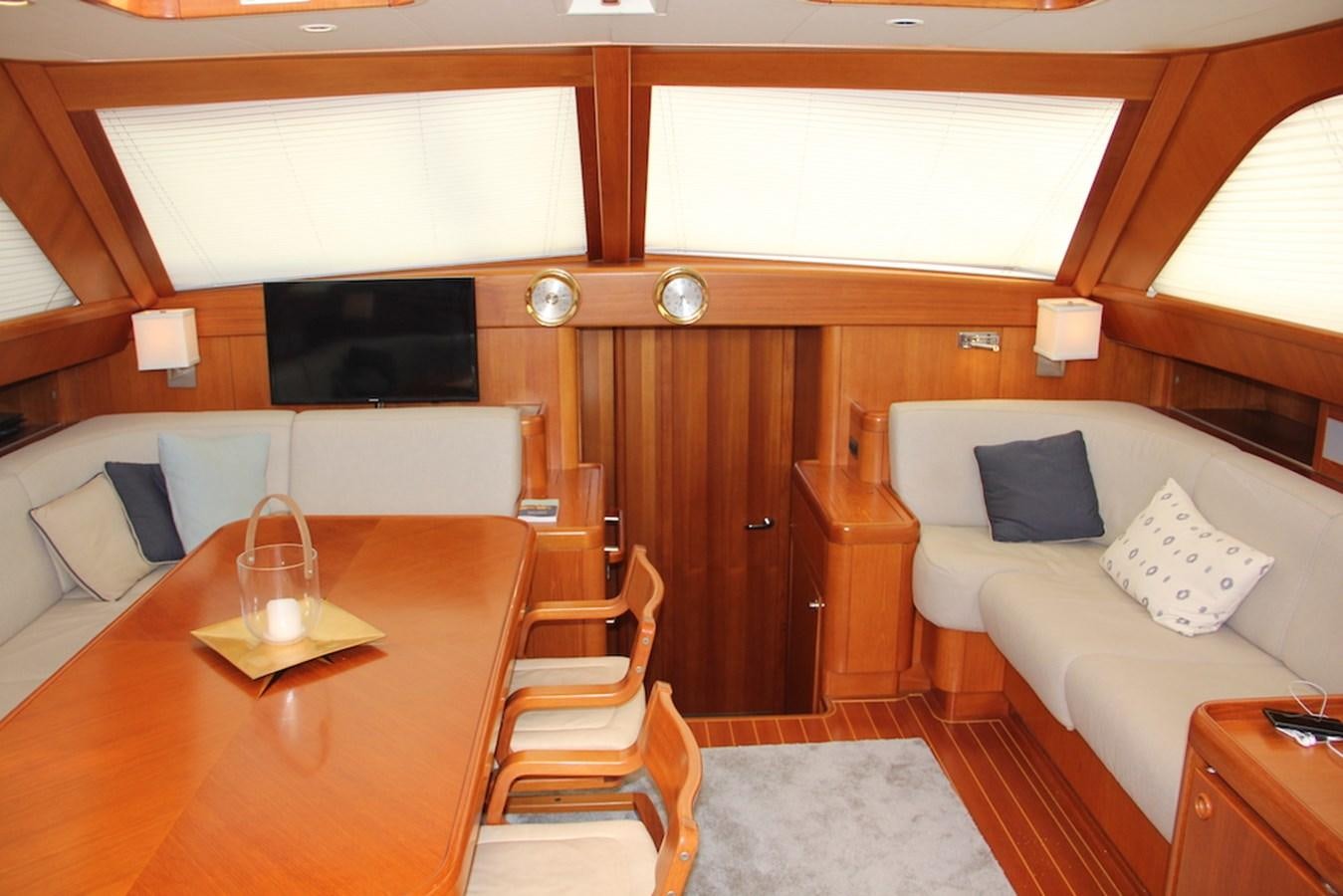 a room with a couch and a table aboard MAYANGSARI Yacht for Sale