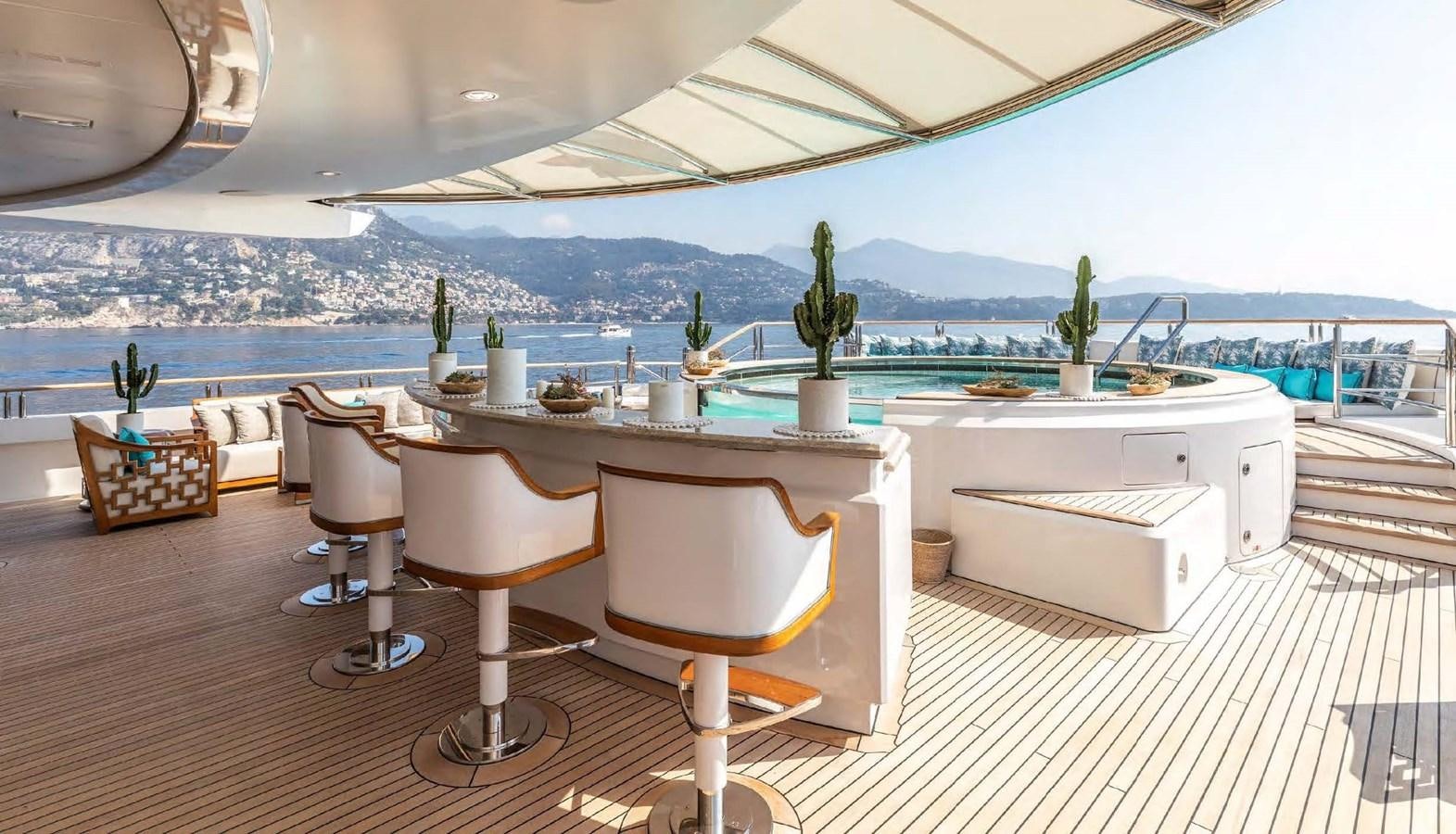 a table and chairs in a room aboard SAMSARA Yacht for Charter