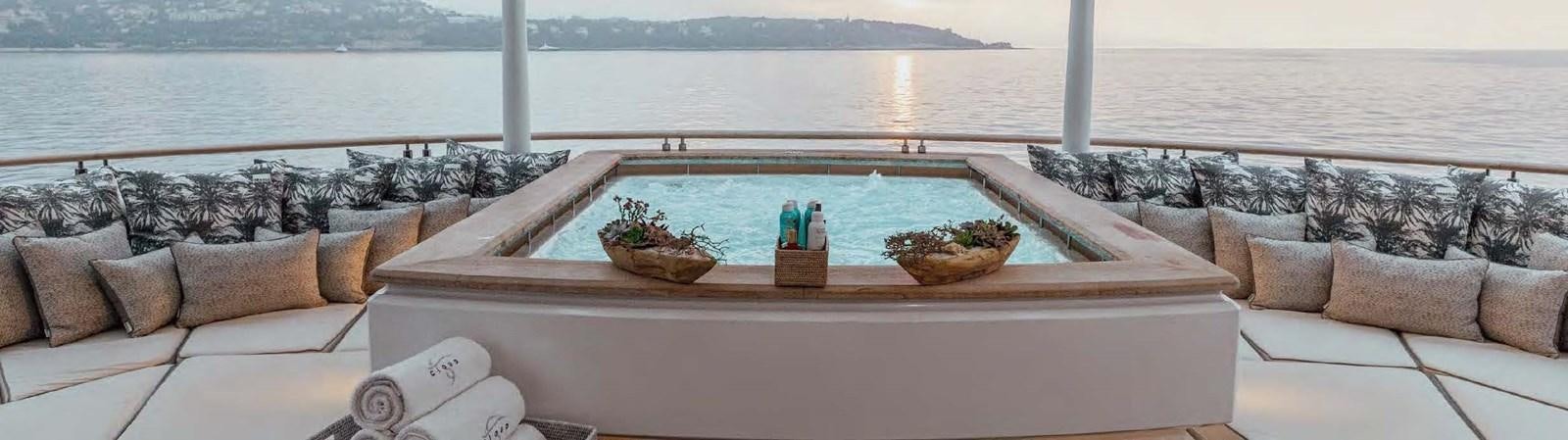 a patio with a table and chairs aboard SAMSARA Yacht for Charter