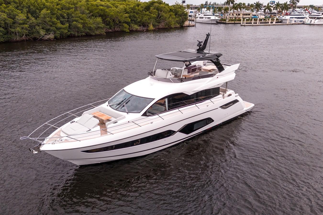 a white boat on the water aboard MANHATTAN 68 Yacht for Sale
