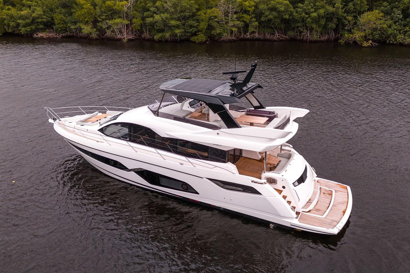 a white boat on water aboard MANHATTAN 68 Yacht for Sale