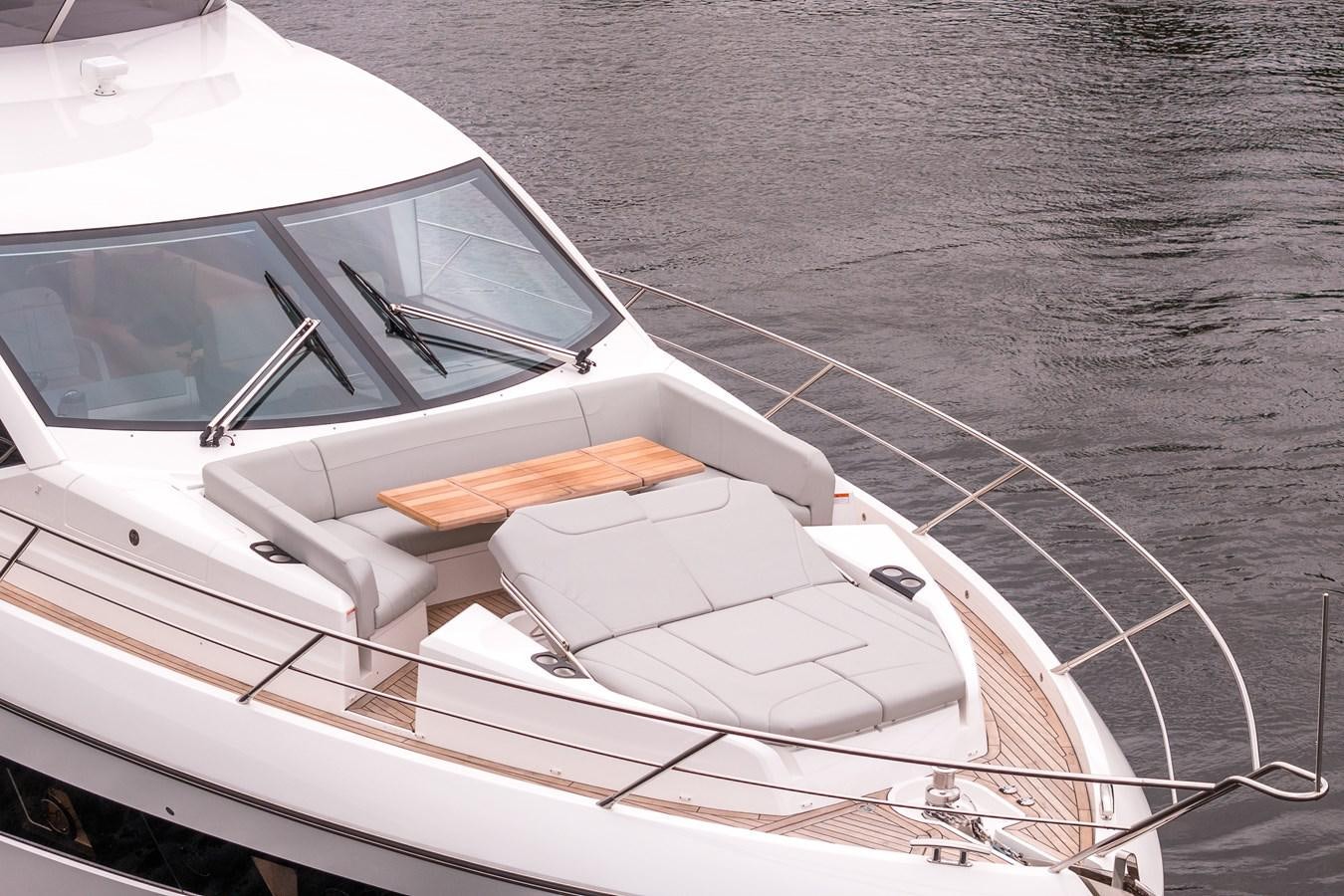 a white boat on the water aboard MANHATTAN 68 Yacht for Sale