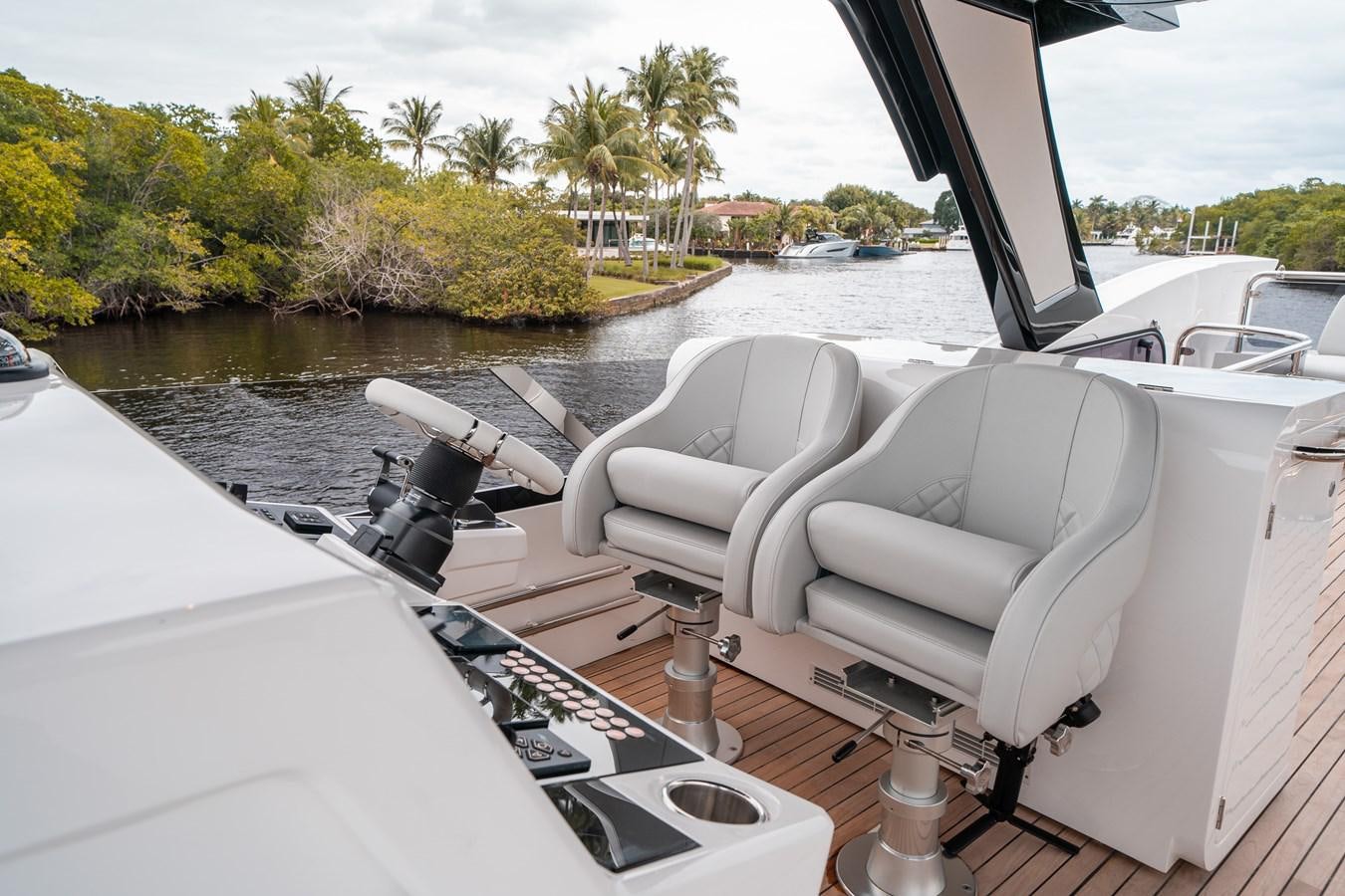 a boat with seats on it aboard MANHATTAN 68 Yacht for Sale