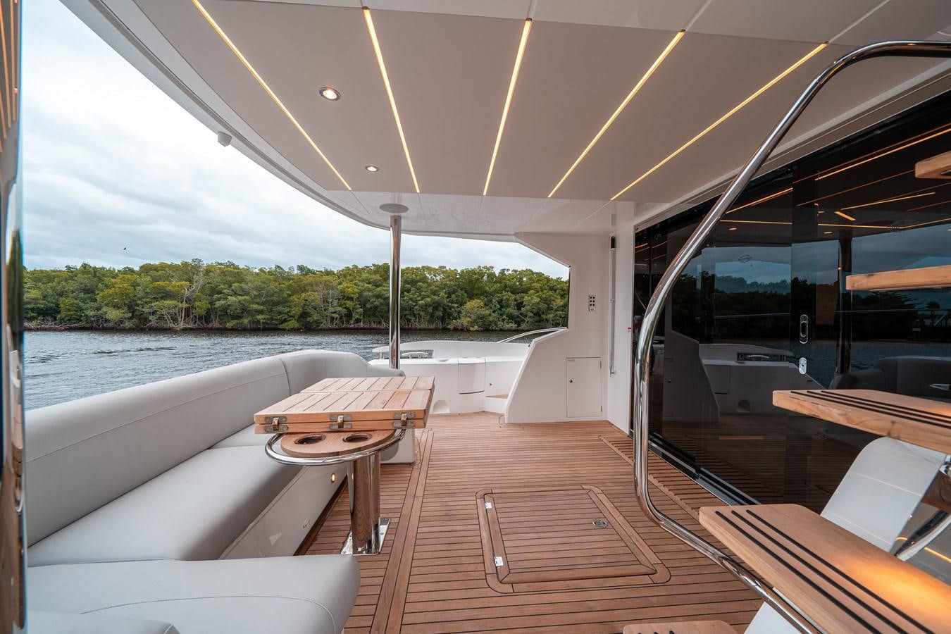 a boat with a table and chairs aboard MANHATTAN 68 Yacht for Sale