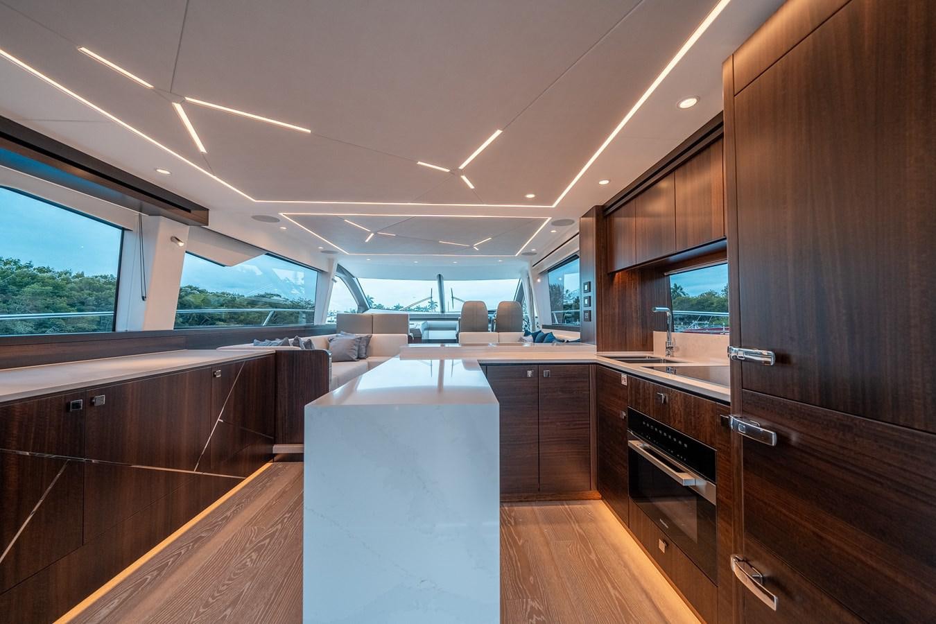 a room with a wood floor and a piano and a wood cabinet aboard MANHATTAN 68 Yacht for Sale