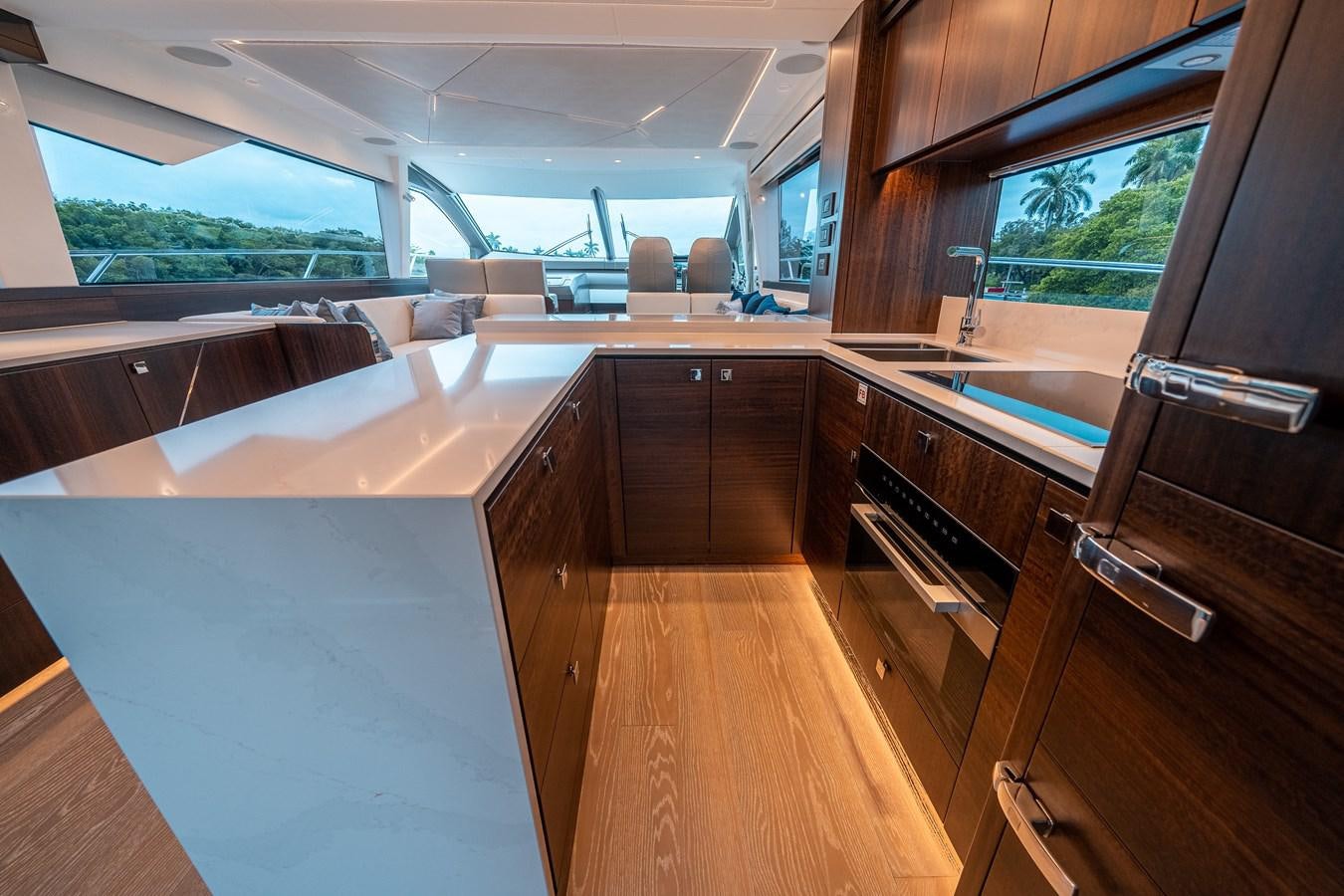 a kitchen with a large window aboard MANHATTAN 68 Yacht for Sale