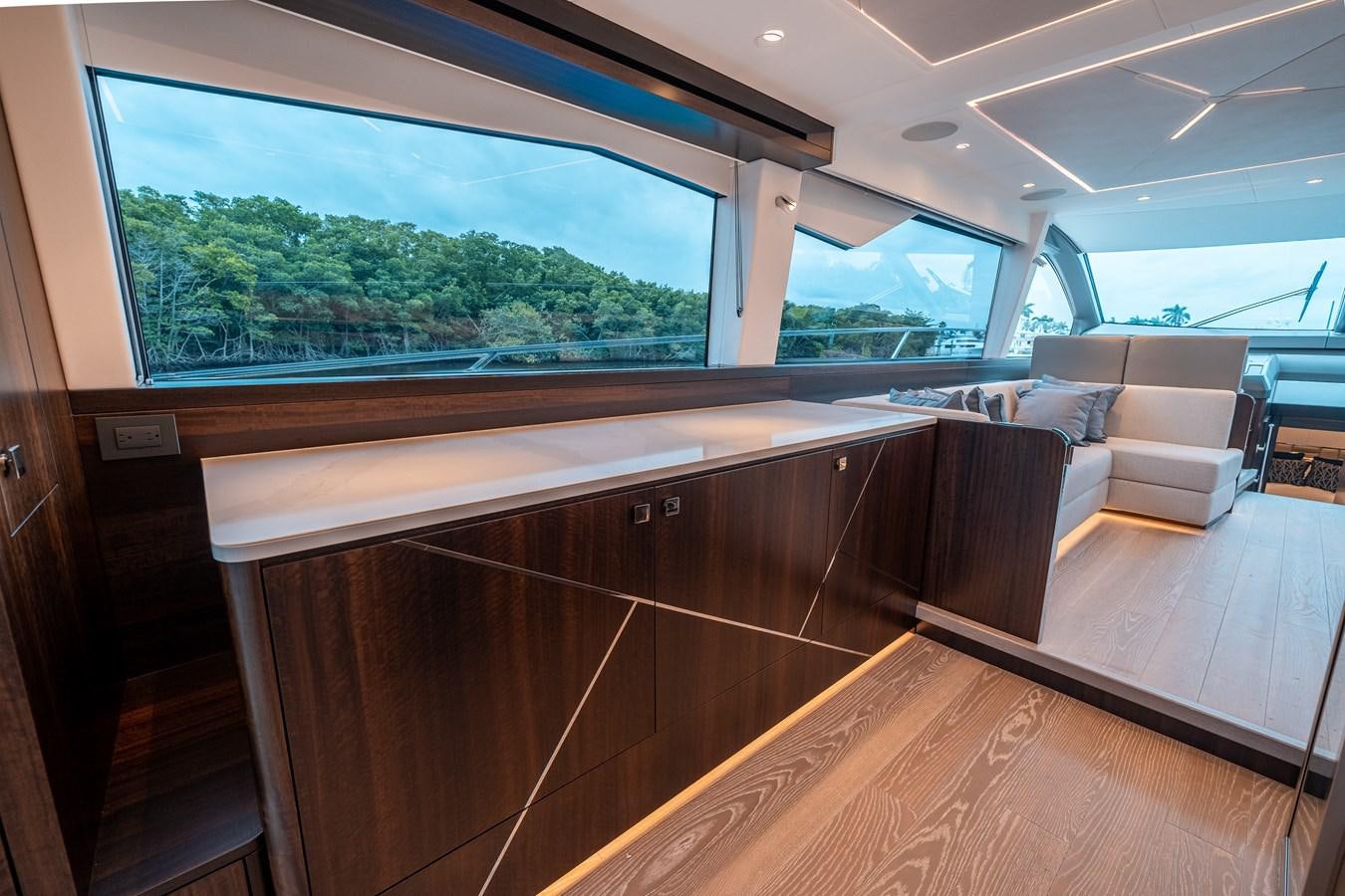 a room with a large window and a wood floor aboard MANHATTAN 68 Yacht for Sale