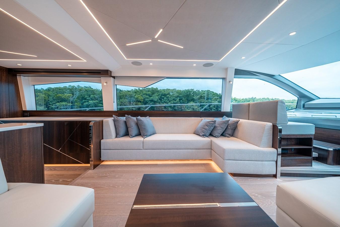 a living room with a couch and a table aboard MANHATTAN 68 Yacht for Sale